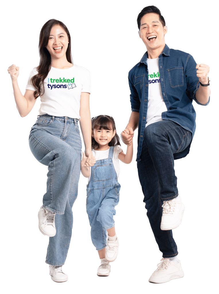 Man, woman, and child holding hands and cheering wearing I trekked Tysons tshirts